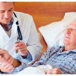 Patient in hospital bed, Dr taking pulse – resized_630x440